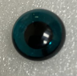 Blue Green round pupil pig tail